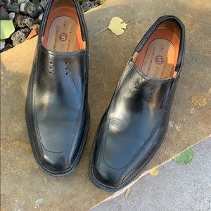 Clark’s black leather slip on shoes